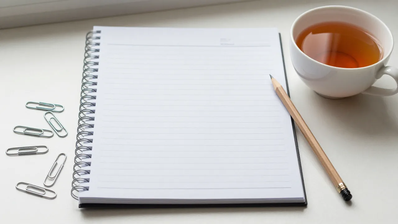 notebook and blank worksheet for calculate numerology name